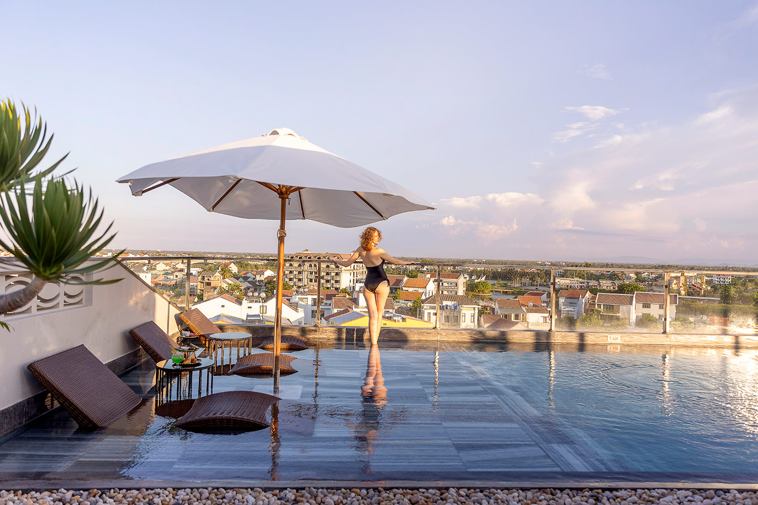 The rooftop pool overlooking Hoi An at sunset